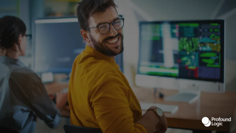 Man smiling in front of his work