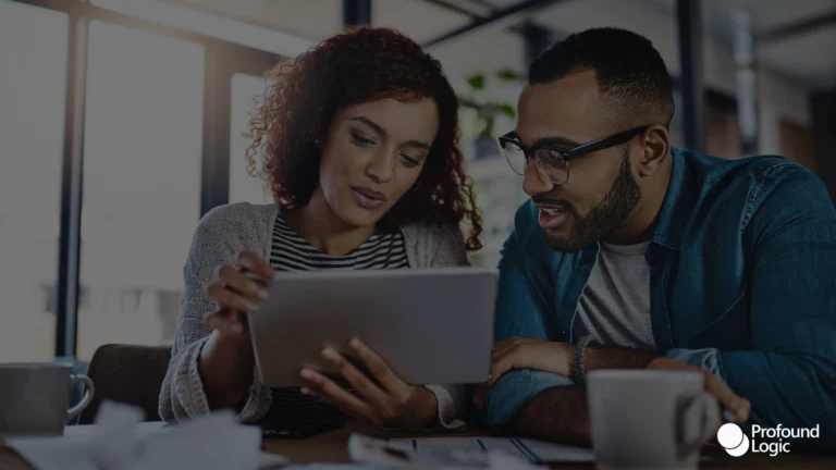 A woman and a man checking some papers together for work