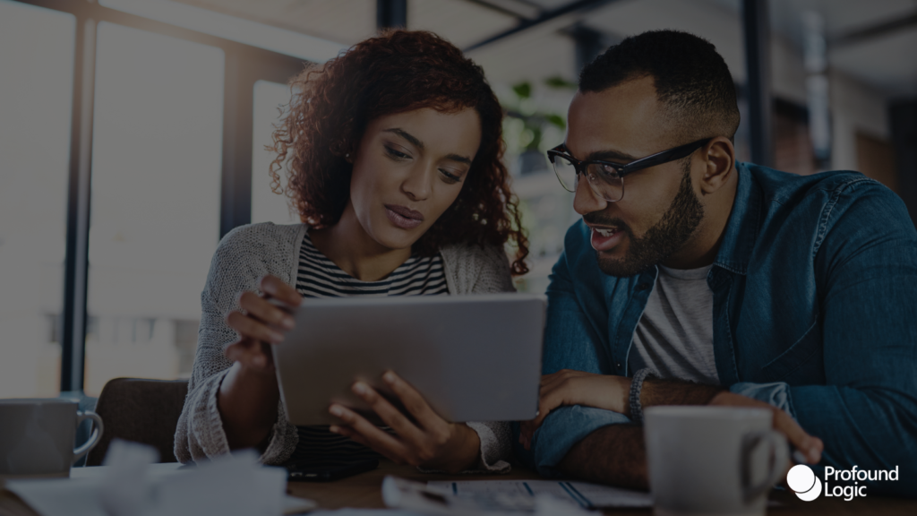 A woman and a man checking some papers together for work