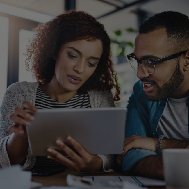 A woman and a man checking some papers together for work