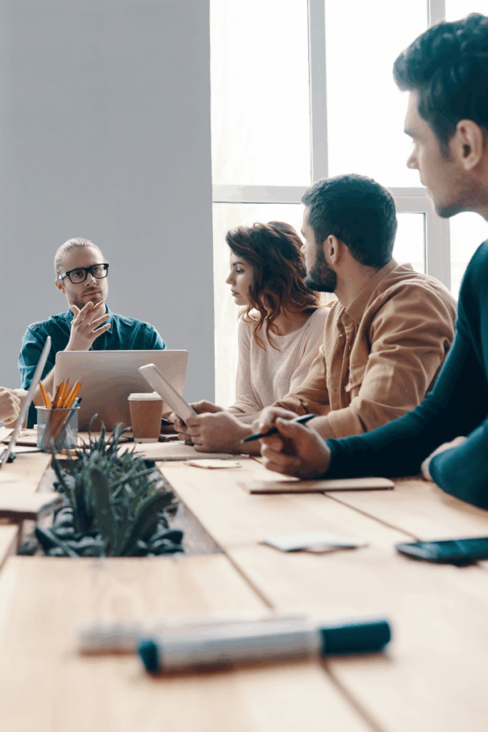 four people working at a table